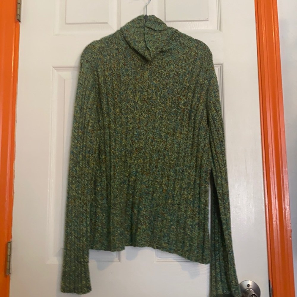 Green knitted turtleneck sweater